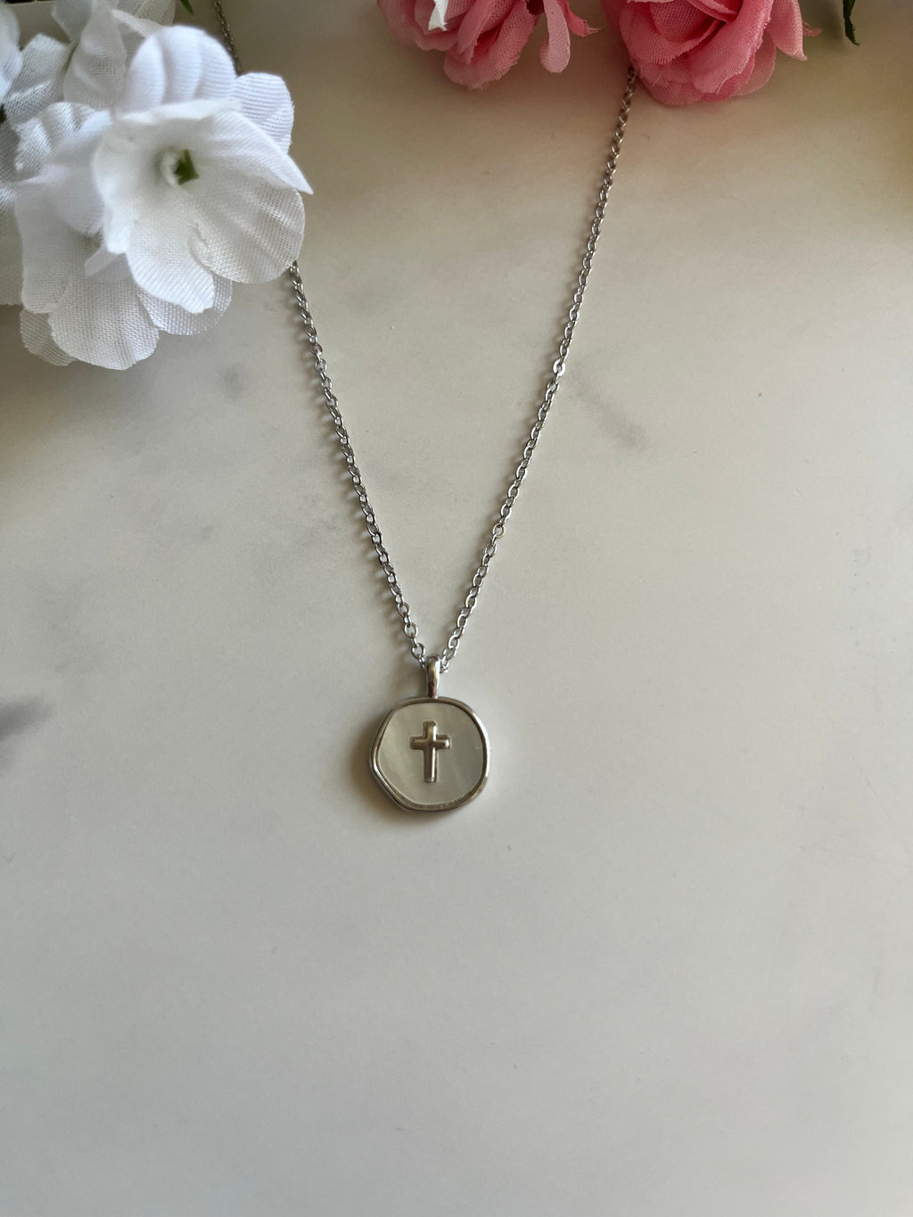 Silver cross pendant necklace with round disc charm and small chain