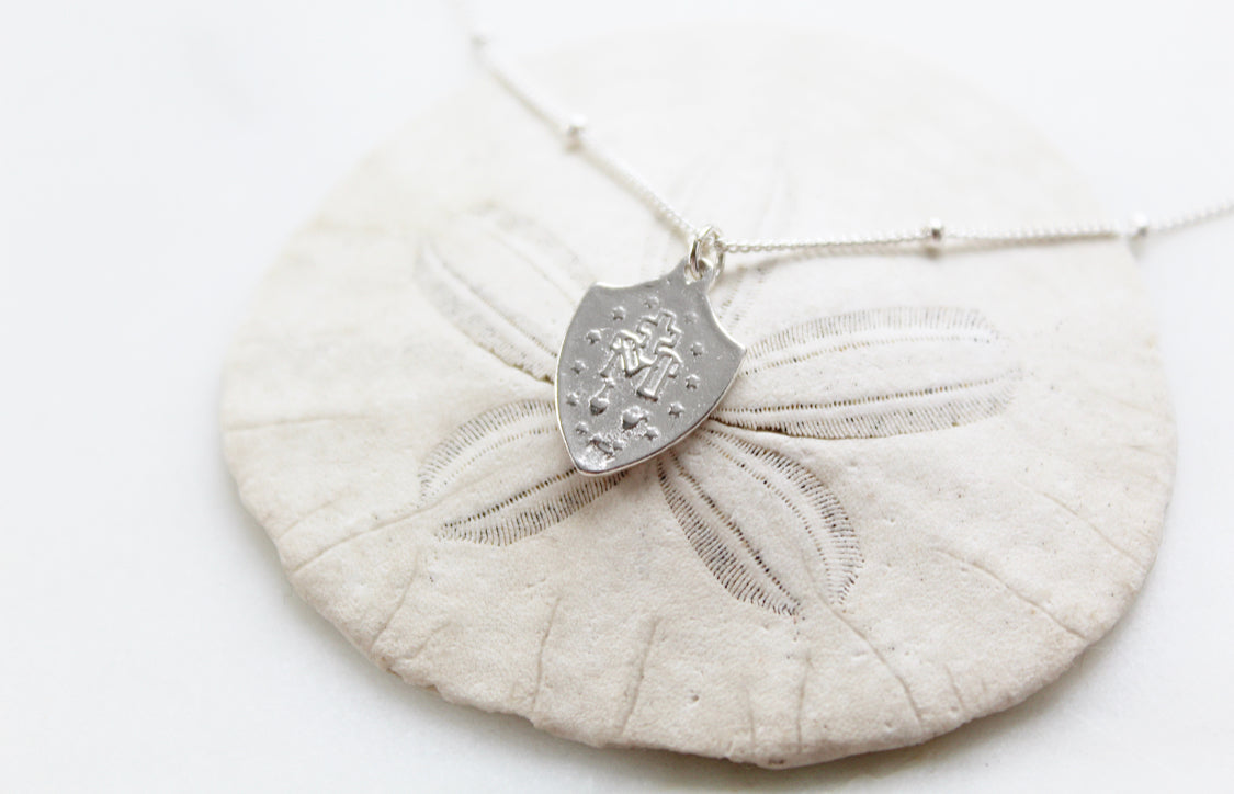 Sterling silver shield pendant necklace with etched back pattern on ball chain