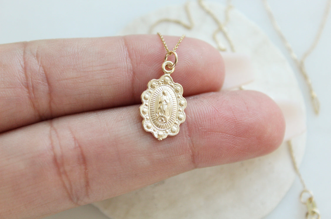 14k gold Our Lady of Guadalupe scalloped pendant front view on chain