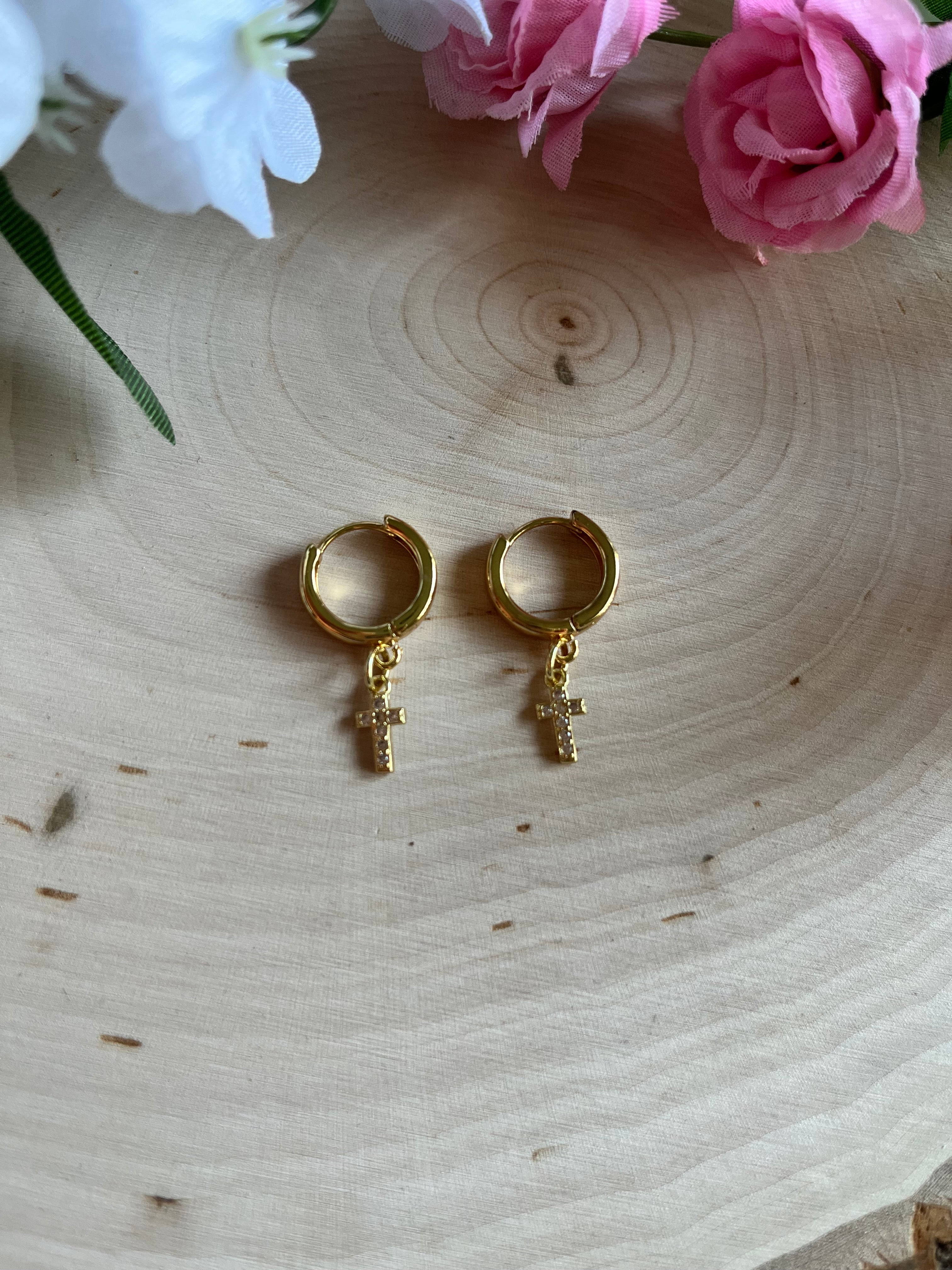 Gold hoop earrings with cross dangle charms, pair view