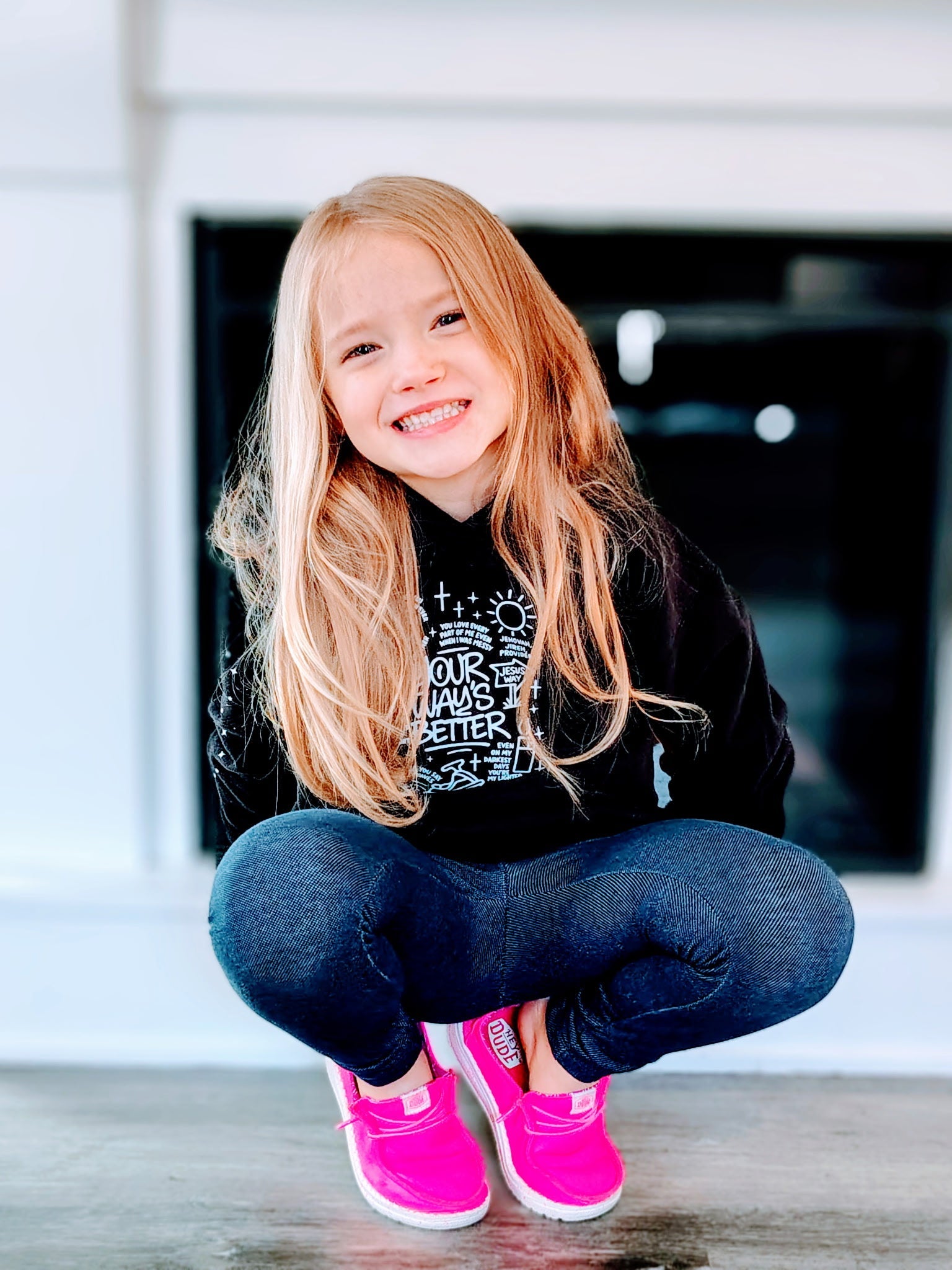 Black kids hoodie with front graphic print; hood and long sleeves