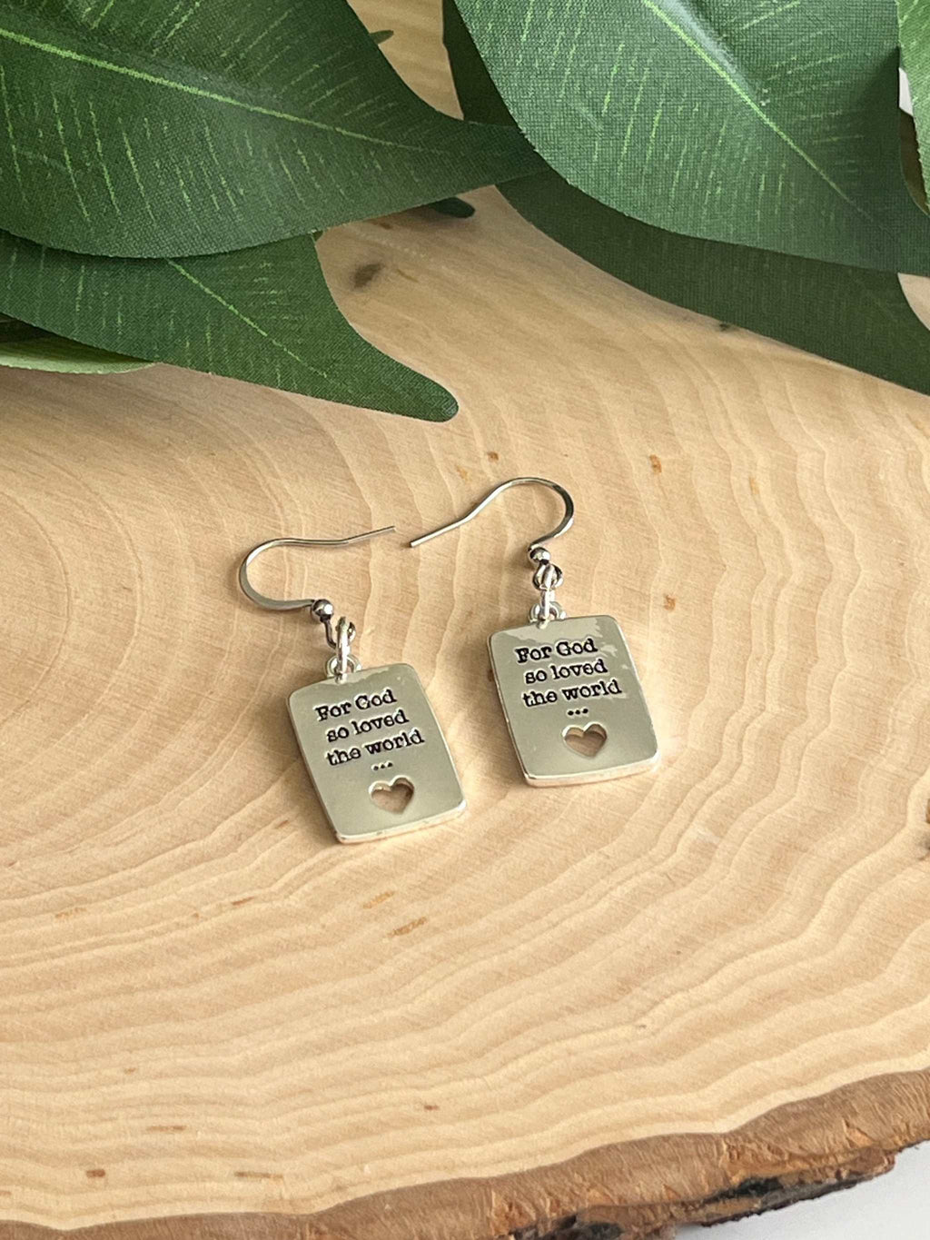 Silver dangle earrings with square engraved tags and heart cutout; 'For God so loved the world'