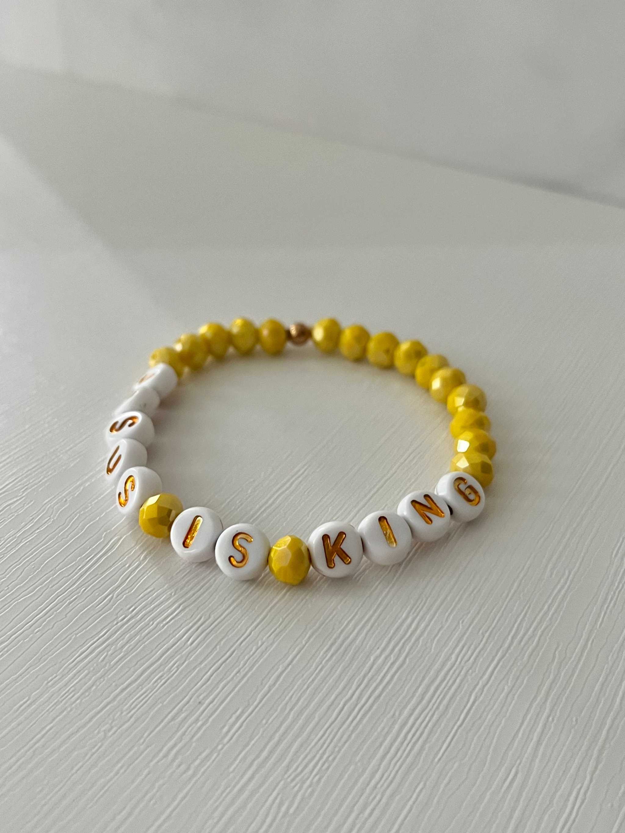 Bead bracelet with white letter beads and yellow round beads, JESUS KING