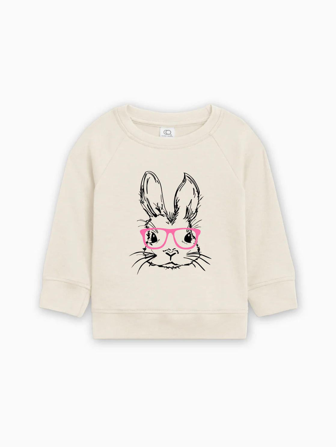 Organic cotton baby pullover in natural with bunny face graphic and pink glasses
