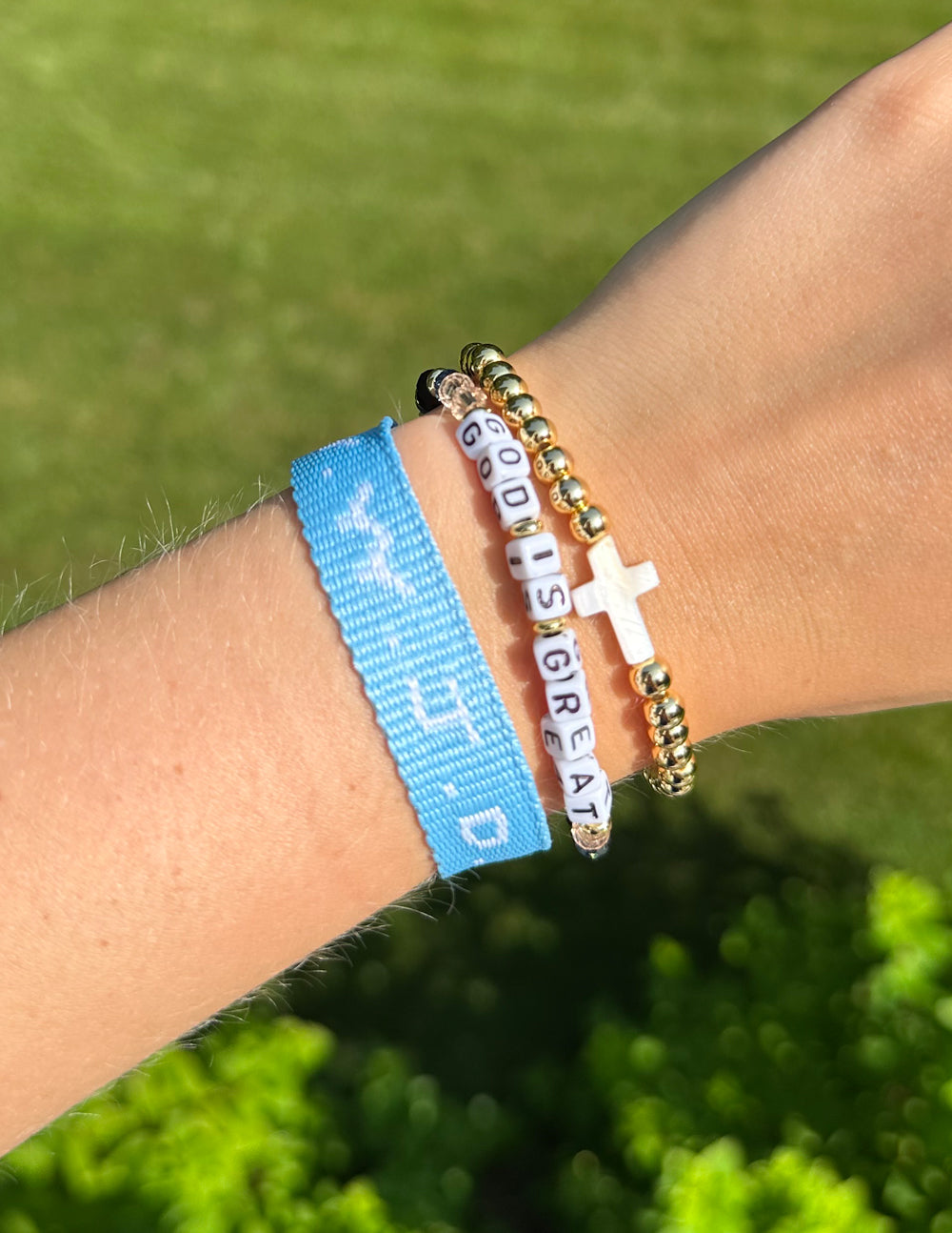 God Is Great letter bead bracelet with white letter beads, dark blue and gold beads, cross charm