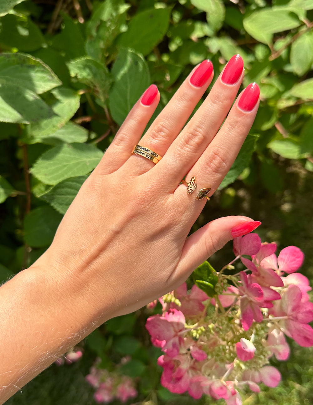 Gold-tone ring with engraved band and small charm