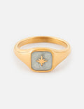 Gold-tone ring with square light blue enamel bezel and sunburst star emblem