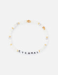Gold beaded letter bracelet with white beads and charm spelling ETERNAL.