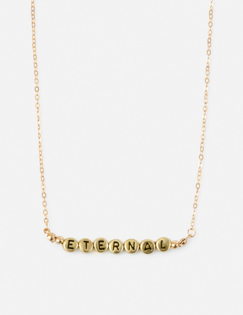 Gold-tone letter beaded necklace with round beads spelling ETERNAL