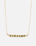 Gold-tone letter beaded necklace with round beads spelling ETERNAL