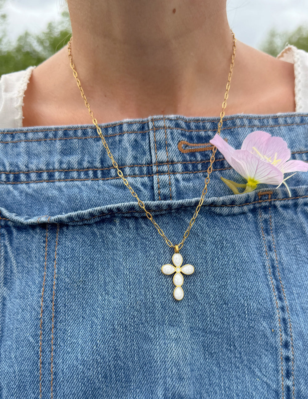 Gold paperclip chain necklace with teardrop cross pendant and pearl-like drop details