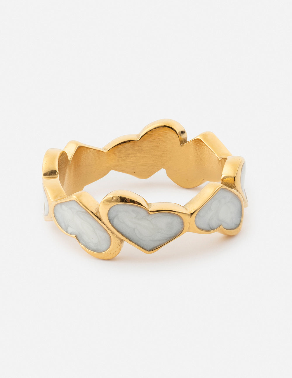 Gold heart-detail ring with three linked heart stones and enamel accents