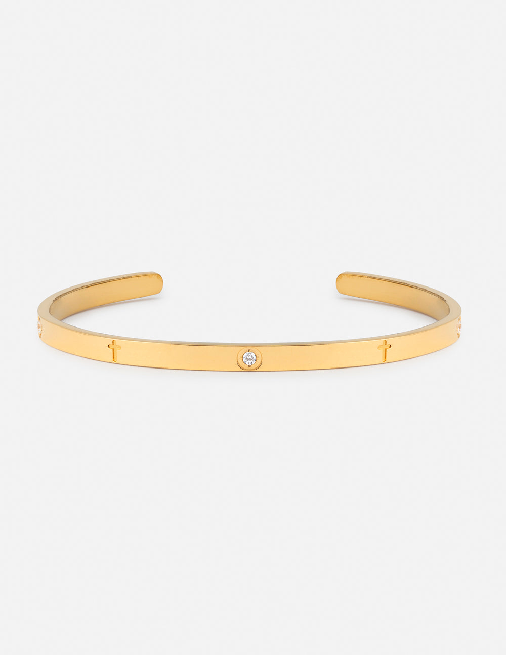 Gold-tone cuff bracelet with small gemstone accents and slim engraved links