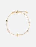 Gold link bracelet with small multicolor stones and a gold cross charm