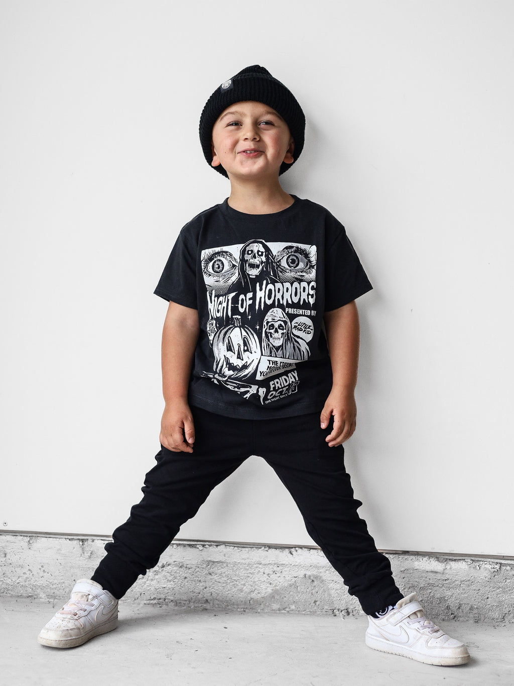 Black kids graphic T-shirt with horror characters and bold “Night of Horrors” print