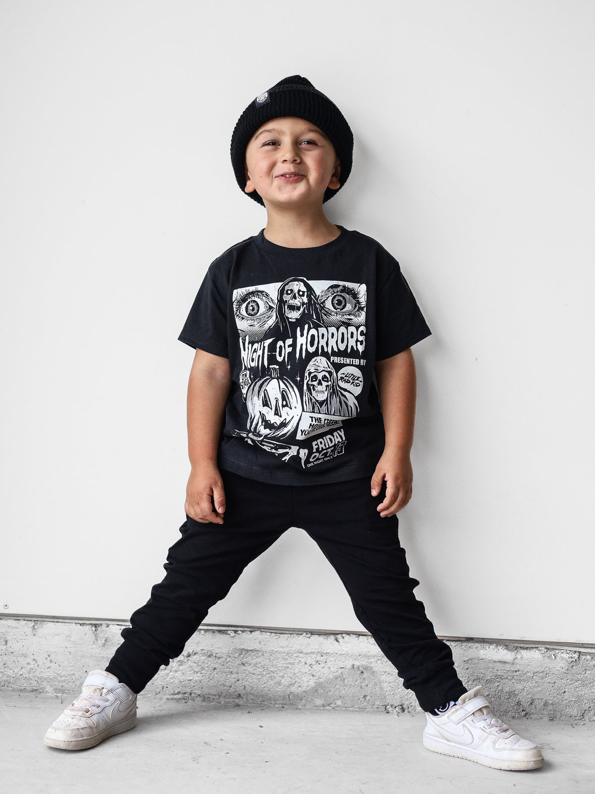 Black kids graphic T-shirt with horror characters and bold “Night of Horrors” print