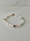 Handmade multicolor bead bracelet with cross charm and pastel beads
