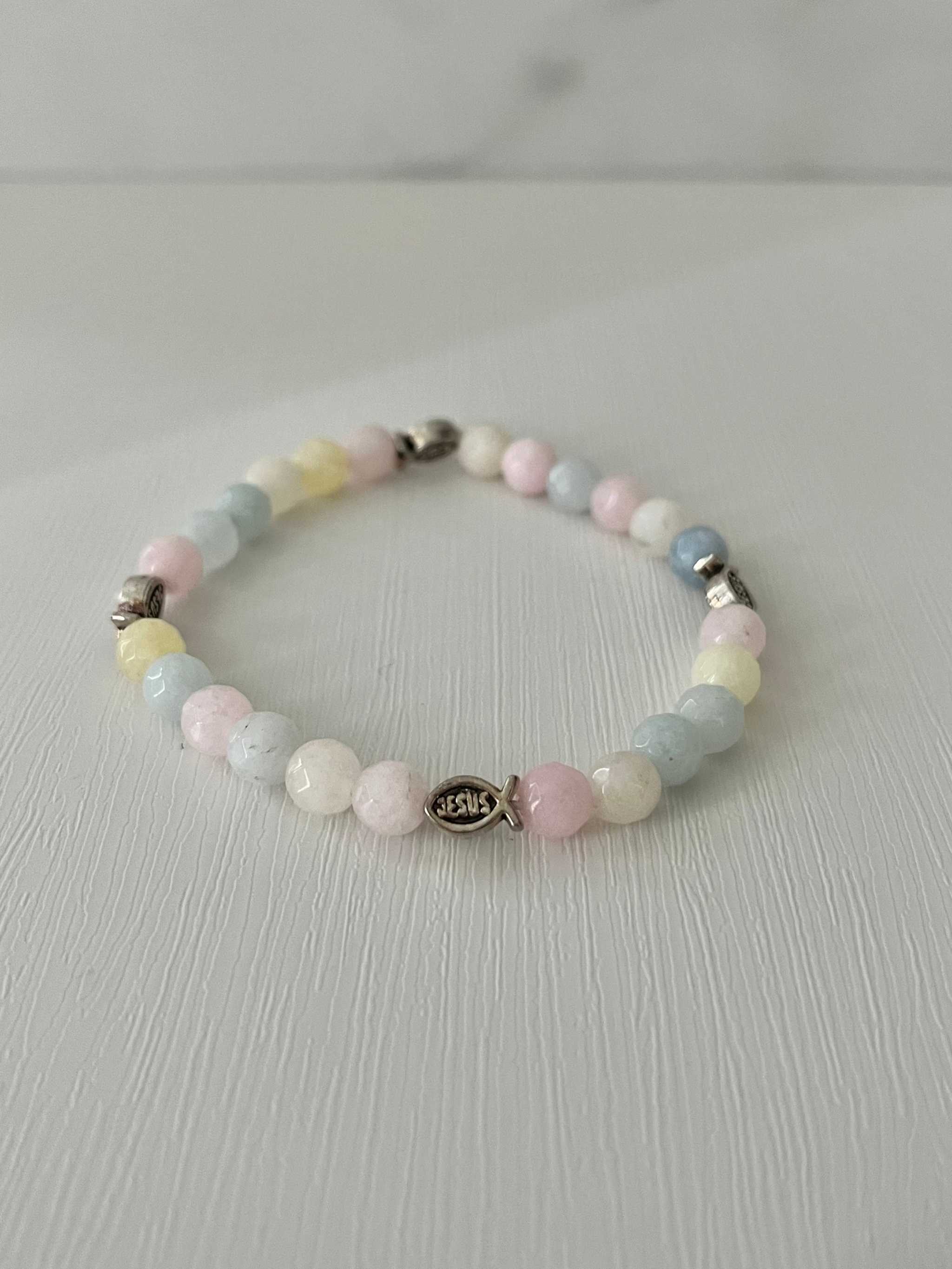 Handmade multicolor bead bracelet with cross charm and pastel beads