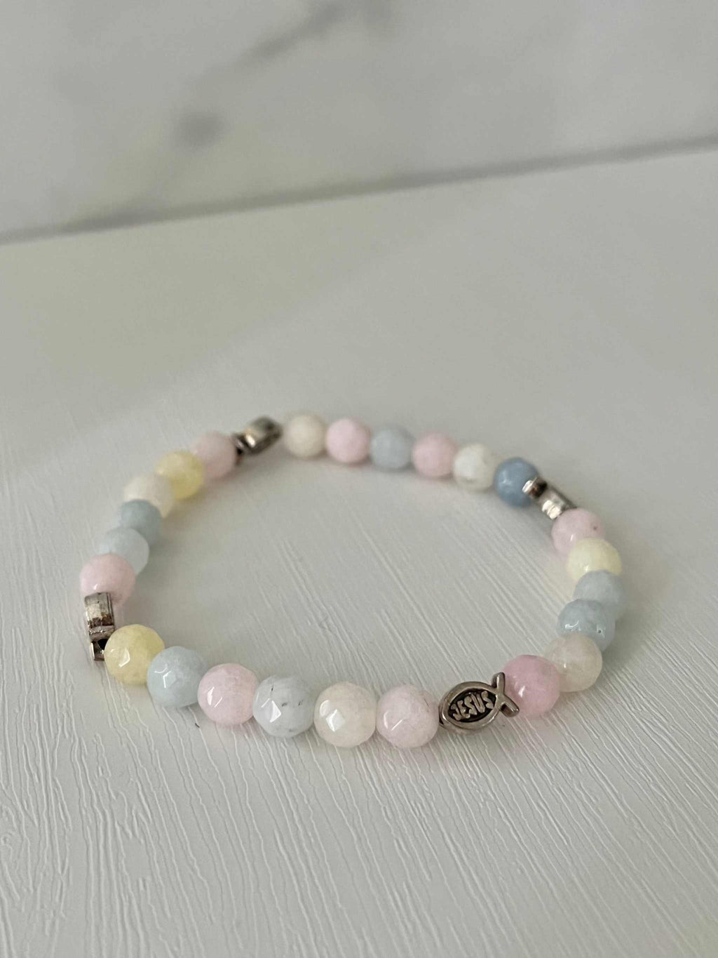 Multicolor bead bracelet with cross charm, pastel pink blue and yellow beads