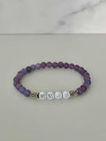 Purple natural stone bead bracelet with WWJD letter beads and small faith charm