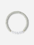 Gray heishi bead letter bracelet with spaced alphabet charms