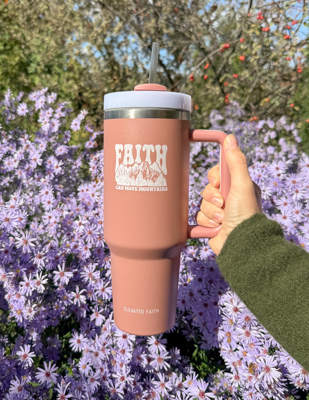 40 oz insulated tumbler in rose pink, front “FAITH” print with straw lid