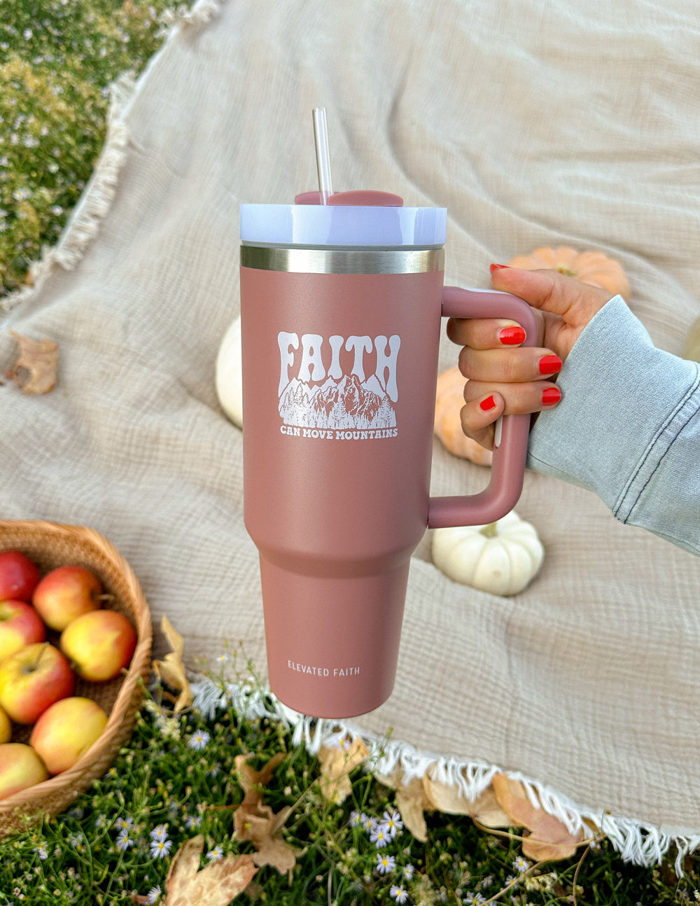 Rose pink 40 oz insulated tumbler with straw lid and “FAITH” graphic