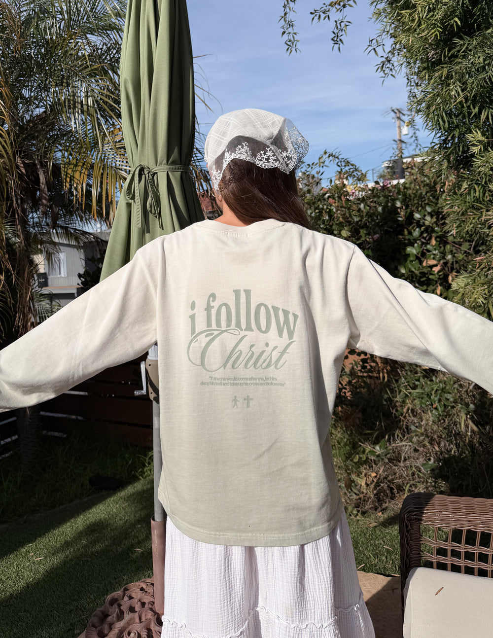 Light cream long-sleeve tee with large 'i follow Christ' back print