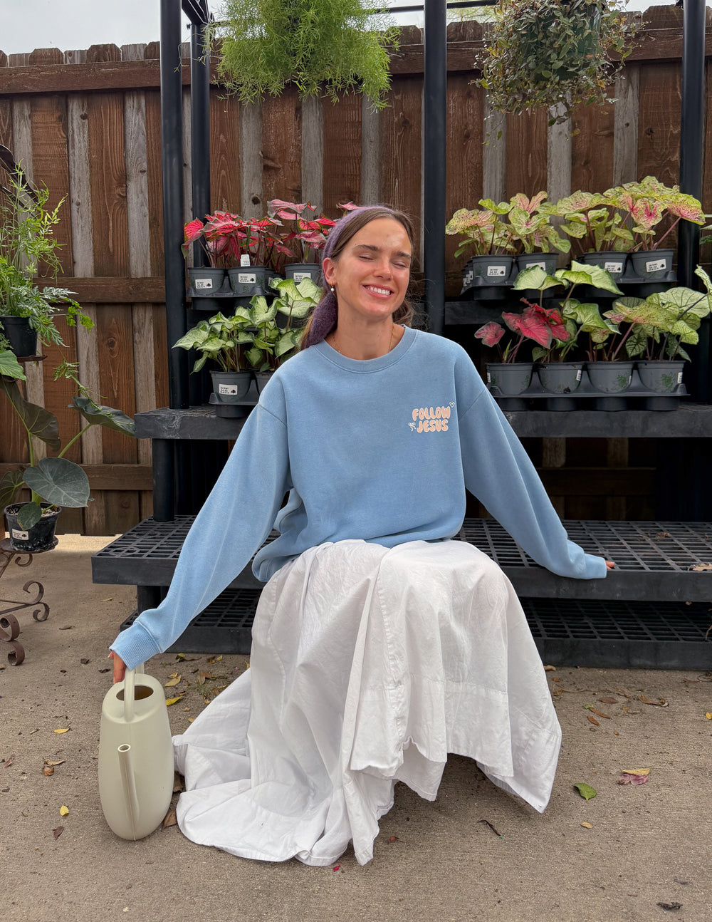 Light blue unisex crewneck sweatshirt, small front “Follow Jesus” logo
