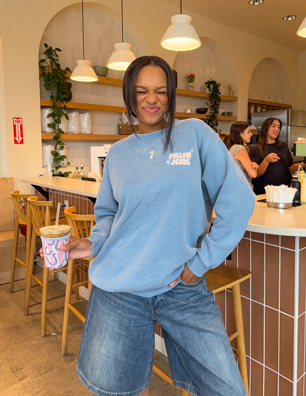Light blue unisex crewneck sweatshirt, small chest “Follow Jesus” graphic