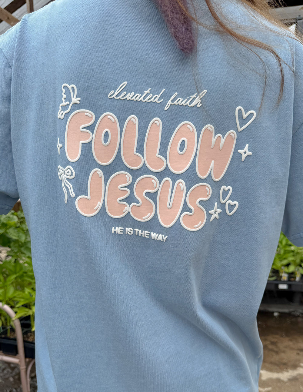 Unisex light blue T-shirt with large back "Follow Jesus" graphic and heart details