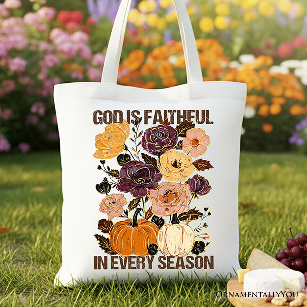 White cotton tote bag with floral 'God is faithful' and 'in every season' text