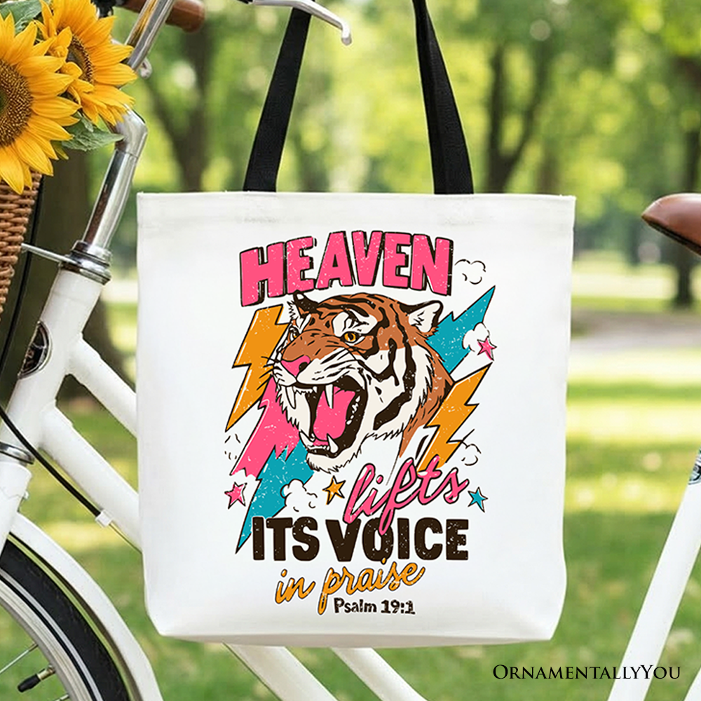 White cotton tote bag with colorful tiger graphic and Christian quote print on front.