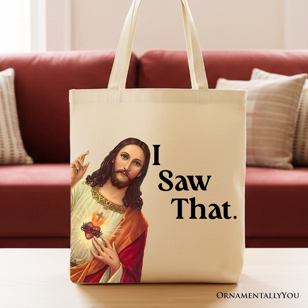 Canvas tote bag with Jesus portrait and “I Saw That.” text, standing on sofa.