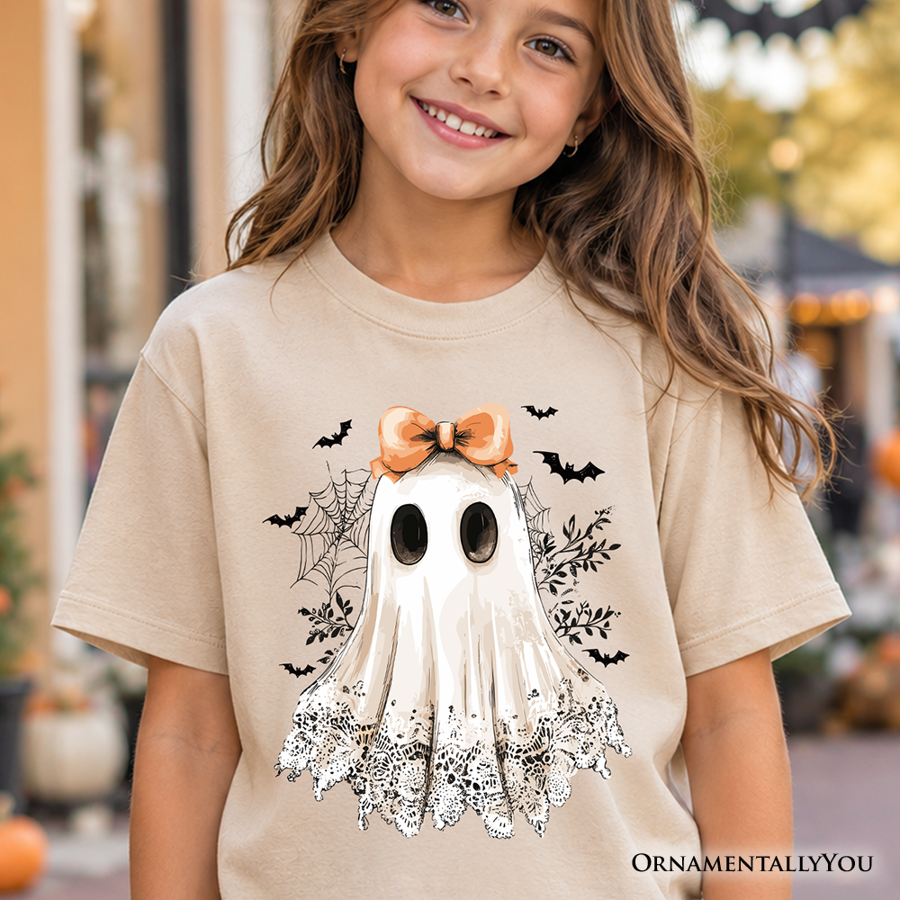 Sand kids T-shirt with centered ghost graphic, orange bow, short sleeves
