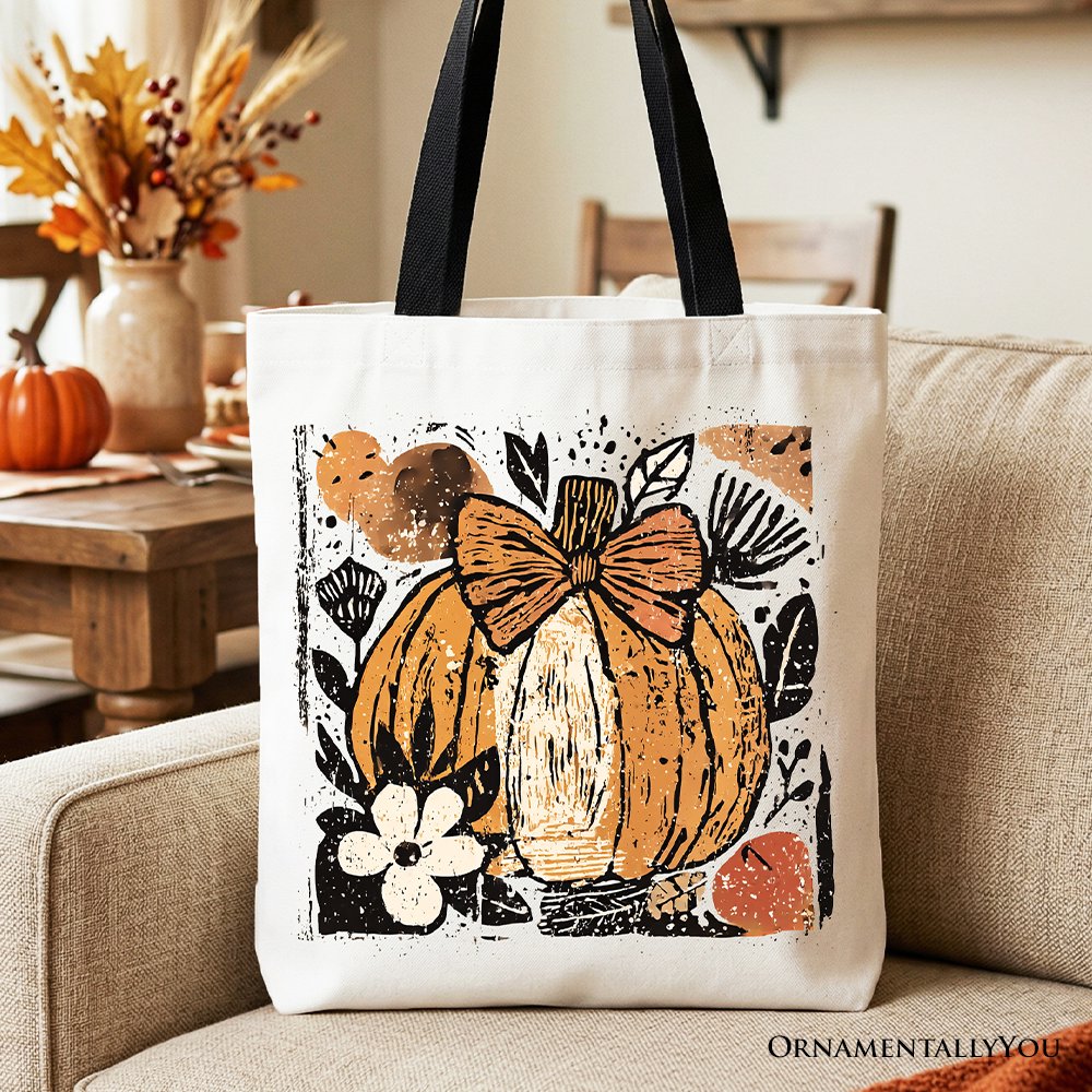 White canvas tote bag with orange pumpkin floral bow front