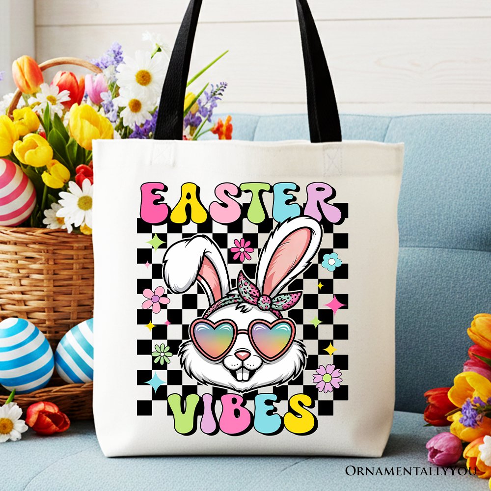 White cotton tote bag with black handles and 'Easter Vibes' bunny graphic.