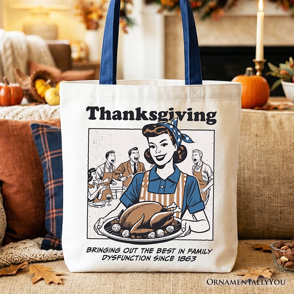 White cotton tote bag with navy handles and Thanksgiving graphic text on the front.