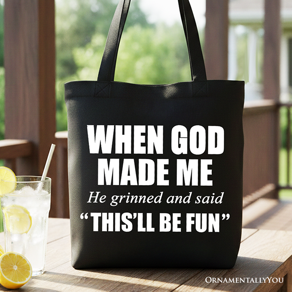 Black canvas tote bag with long handles, front print “WHEN GOD MADE ME”.
