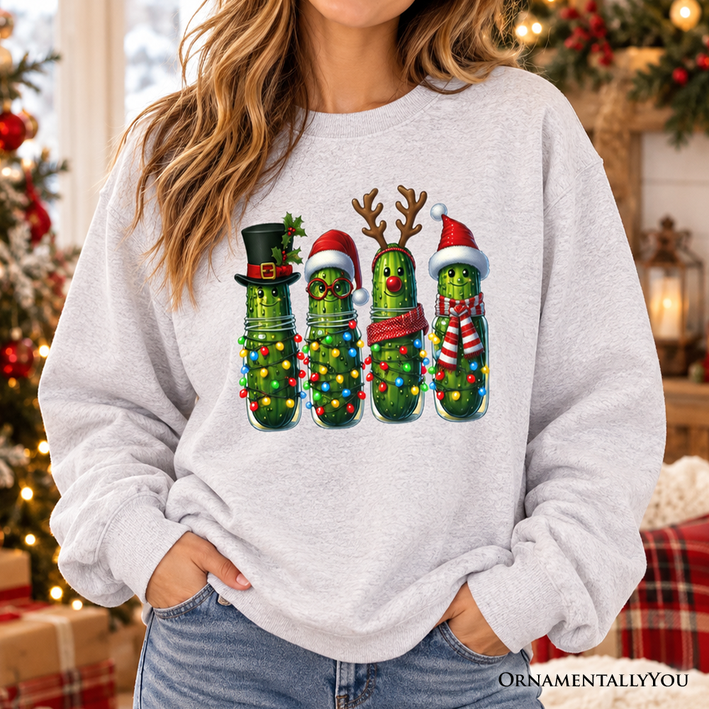 Ash crewneck sweatshirt with festive pickle character graphic on the front