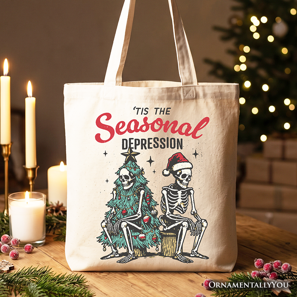 White cotton tote bag with 'Seasonal Depression' print and skeleton-and-tree illustration
