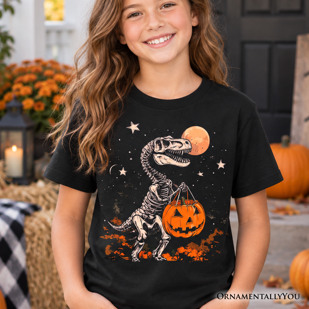 Kids black crew-neck T-shirt with dinosaur skeleton, moon, stars, and pumpkin graphic