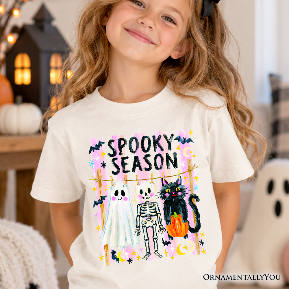 Kids white spooky season T-shirt featuring colorful “Spooky Season” and cartoon figures