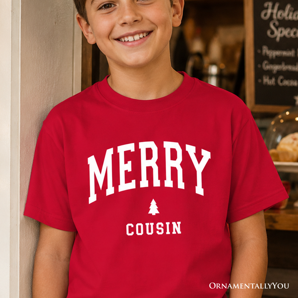 Kids red Christmas T-shirt with white 'MERRY COUSIN' graphic and tree icon
