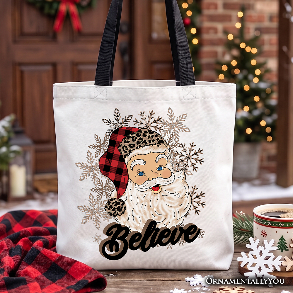 Believe Santa buffalo plaid tote bag with snowflakes graphic and black handles