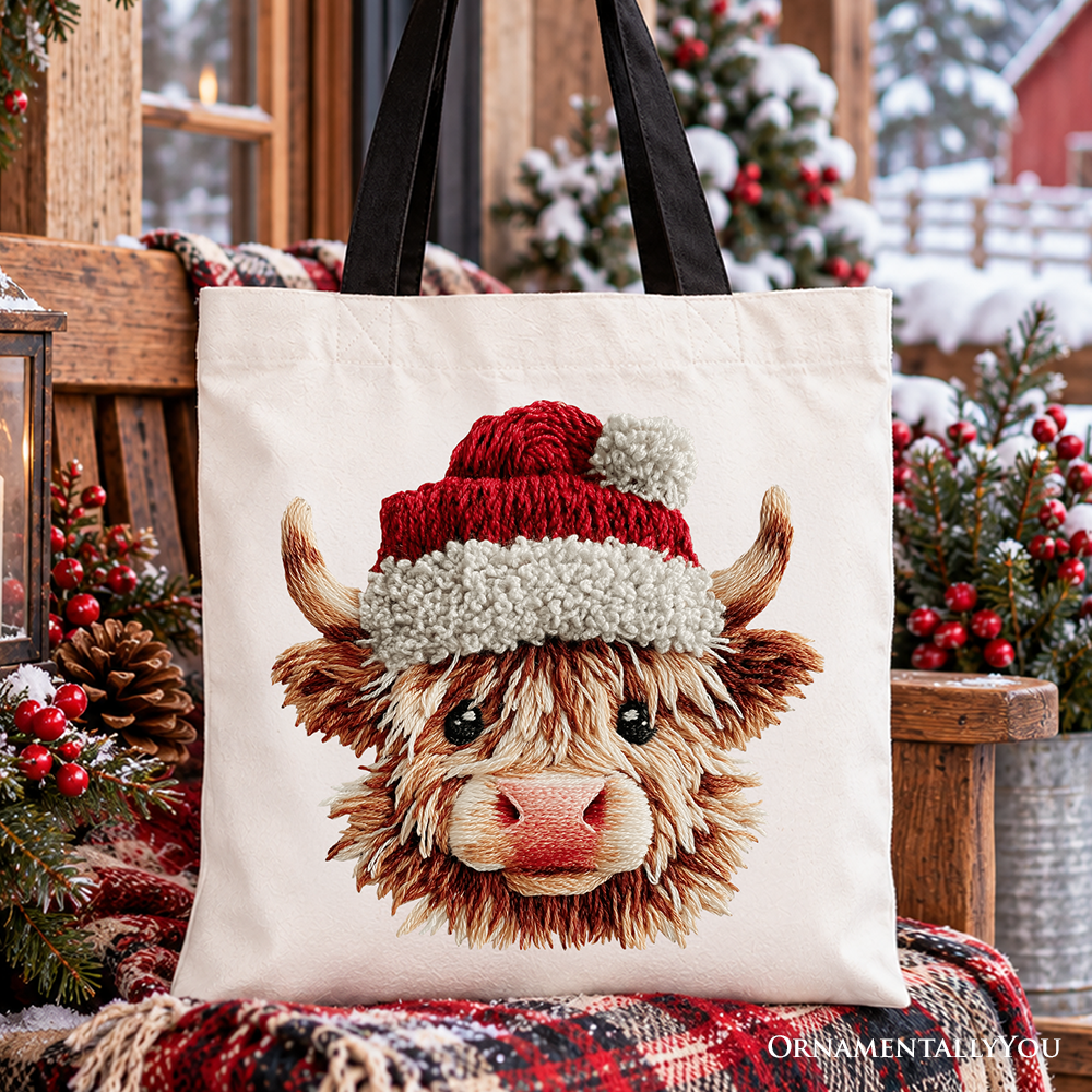 Cream canvas tote bag with Highland cow wearing red-and-white Santa hat