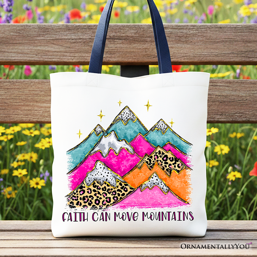 White tote bag with navy handles, colorful mountain and leopard graphic, quote