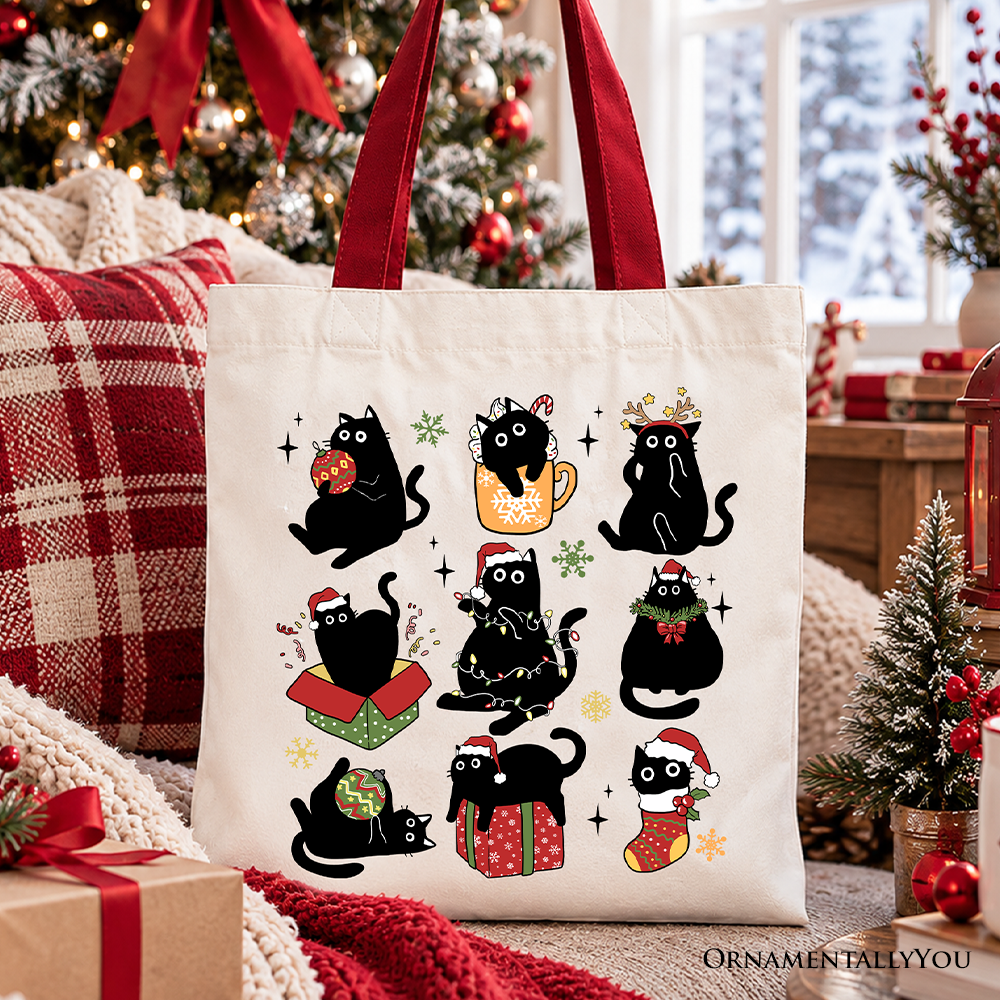 Cotton tote bag with festive black cat illustrations, Santa hats, and red handles