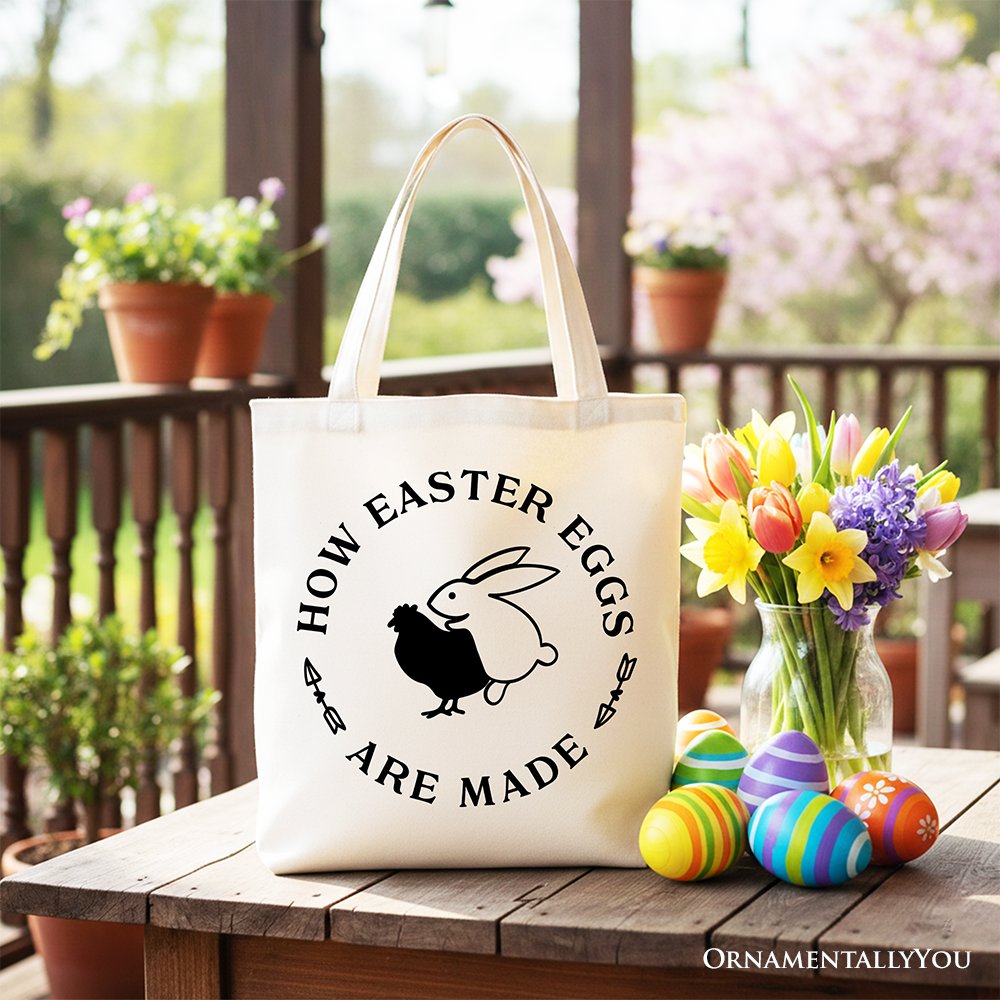 White tote bag with black handles, bunny and 'How Easter Eggs Are Made' text