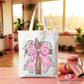 White tote bag with pink bow tree graphic and pink accents, standing upright.